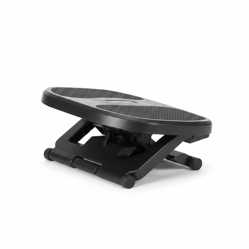 The Remote Desk adjustable black plastic under-desk footrest with a textured non-slip surface and tilt mechanism.