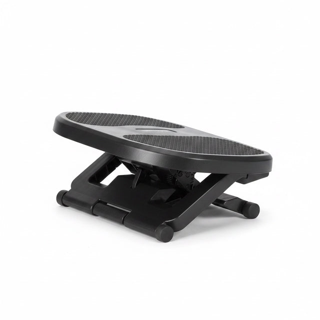 The Remote Desk adjustable black plastic under-desk footrest with a textured non-slip surface and tilt mechanism.