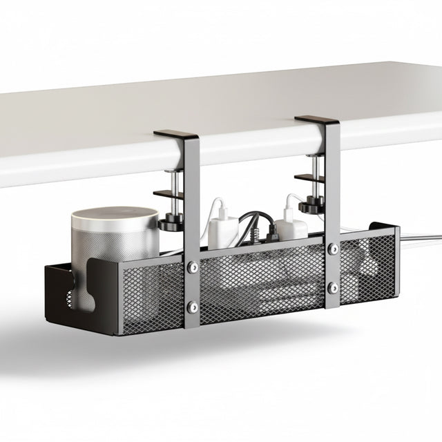 The Remote Desk black carbon steel under-desk cable management rack with mesh design mounted to a white desk edge