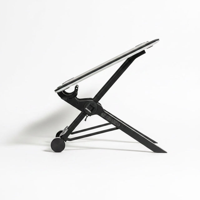 The Remote Desk portable folding laptop stand in black nylon with non-slip contact points, side view