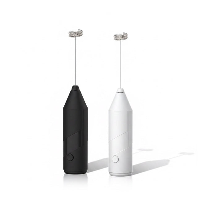 The Remote Desk USB rechargeable handheld milk frothers in black and white with stainless steel whisk attachments.