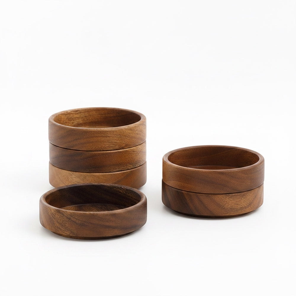The Remote Desk solid wood snack trays in a stackable round design with a smooth natural finish on white background